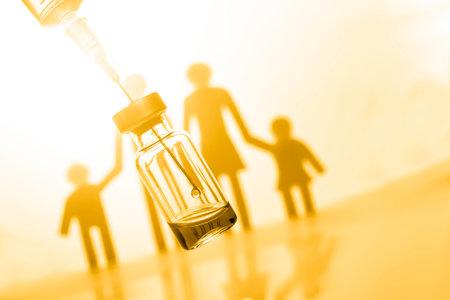 Family immunization concept. Flu vaccine for children. Yellow color filterの写真素材