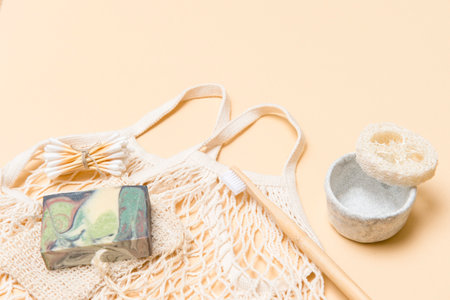 Zero waste bathroom accessories on camel color background. Natural eco bamboo product. Plastic free beauty essentials.の写真素材