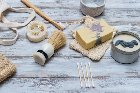 Zero waste bathroom accessories on wooden background. Natural eco bamboo product. Plastic free beauty essentials.の写真素材