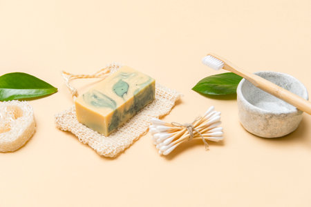 Zero waste bathroom accessories on cream color background. Natural eco bamboo product. Plastic free beauty essentials.の写真素材