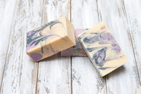 Handmade colorful soaps on wooden table background. Zero waste concept.の写真素材