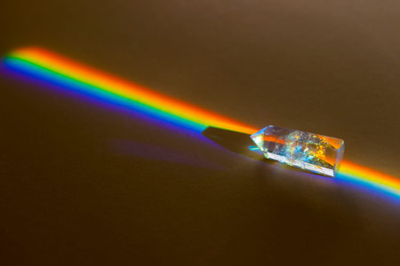 Healing chakra crystals with rainbow on beigeの写真素材