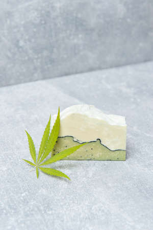 Homemade hemp soap and green leaf of marijuana. Spa organic soap. Organic skincare product with medicinal CBD. Zero waste conceptの写真素材