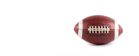 Leather american football on white background. Sports background for product display, banner, or mockupの写真素材