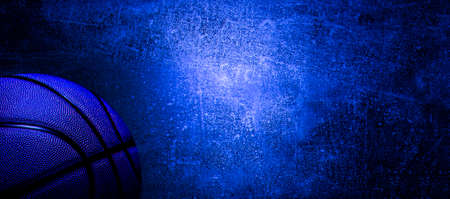 Basketball ball on neon light on concrete wall texture background. Lighting effect blue and red neon background for product display, banner, or mockupの写真素材