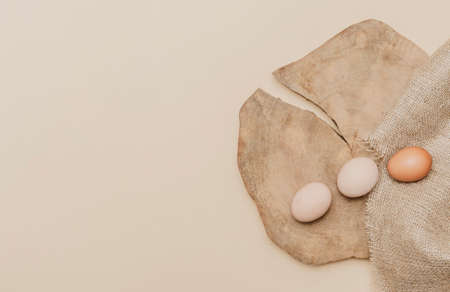 Eggs on old wooden table. Zero waste easter concept. Eco friendly lifestyle, copy spaceの写真素材