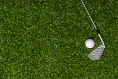 White golf ball and stick on green grass. Horizontal sport poster, greeting cards, headers, websiteの写真素材