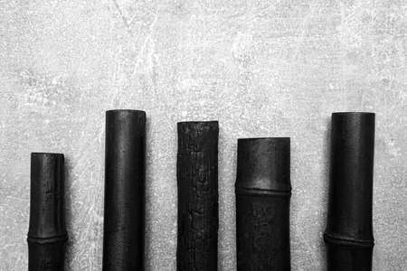 Bamboo activated charcoal sticks isolated on grey backgroundの写真素材