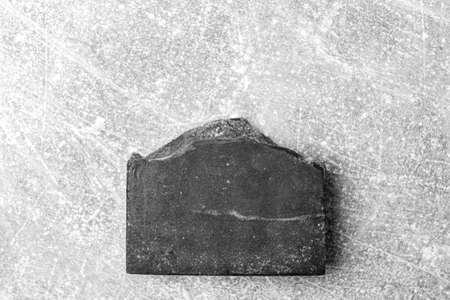 Handmade soap with bamboo coal on grey backgroundの写真素材