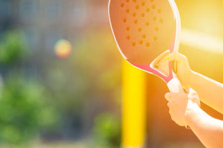 Woman playing beach tennis on a beach. Professional sport conceptの写真素材