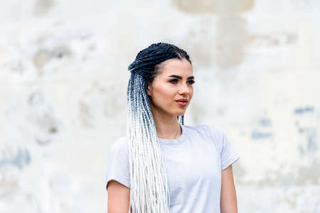 Urban young woman with african braids. Fashion of youthの写真素材