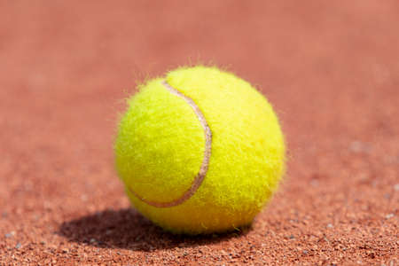 Tennis ball on a tennis clay court. Professional sport conceptの写真素材