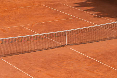 Empty clay tennis court and net. Professional sport concept. Horizontal sport poster, greeting cards, headers, websiteの写真素材