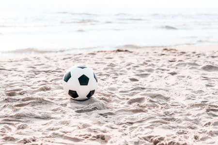 Soccer ball on summer sandy beach. Horizontal sport poster, greeting cards, headers, websiteの写真素材
