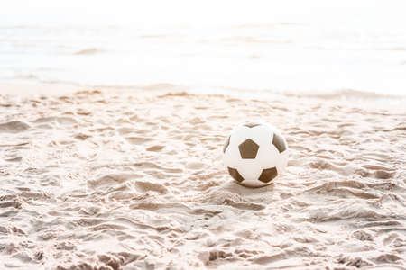 Soccer ball on summer sandy beach. Horizontal sport poster, greeting cards, headers, websiteの写真素材