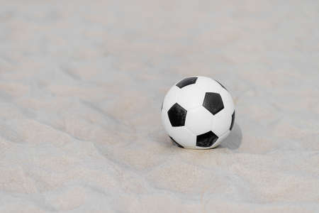 Soccer ball on summer sandy beach. Horizontal sport poster, greeting cards, headers, websiteの写真素材