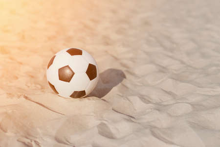Soccer ball on summer sandy beach. Horizontal sport poster, greeting cards, headers, websiteの写真素材