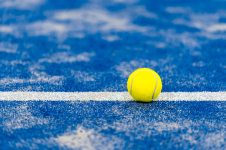 Yellow tennis balls in court on blue turf.  Horizontal sport poster, greeting cards, headers, websiteの写真素材