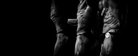 Group athletes bodybuilders posing most muscular fitness competitions. Black and white filter. Horizontal sport poster, greeting cards, headers, website.の写真素材