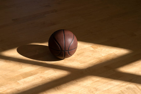 Basketball court wooden floor with professional brown leather ball and shadows. Horizontal sport poster, greeting cards, headers, websiteの写真素材