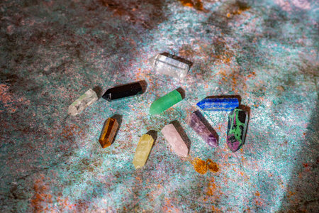 Healing chakra crystals with shadows on magic background. Reiki  and meditation concept