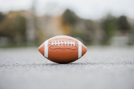New American football ball on new urban court. Horizontal sport poster, greeting cards, headers, website and appの写真素材
