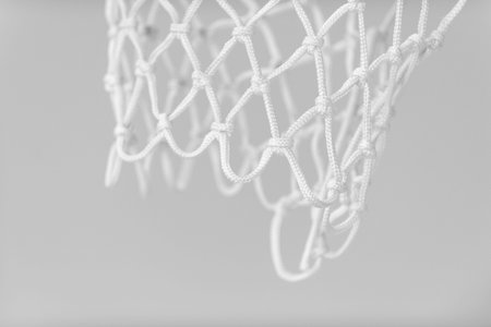Empty Swooshing Basketball Net Close Up with gray background. Horizontal sport theme poster,...
