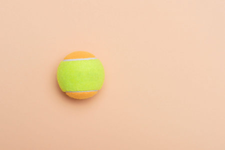 Beach tennis ball on beige background. Horizontal education and sport poster, greeting cards,...