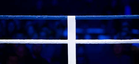 Boxing, muay thai and kickboxing ring ropes with a blur spotlight. Vertical sport theme poster, greeting cards, headers, website and app. Professional sport concept.の写真素材