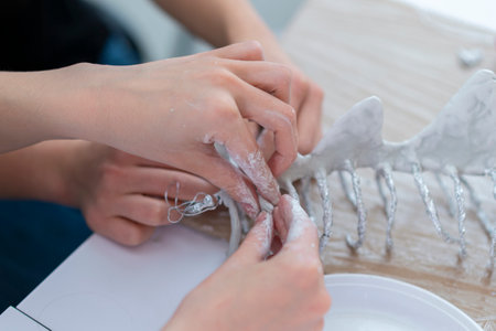 Woman molding and sculpting clay art pieces. Horizontal creative theme poster, greeting cards, headers, website and appの写真素材