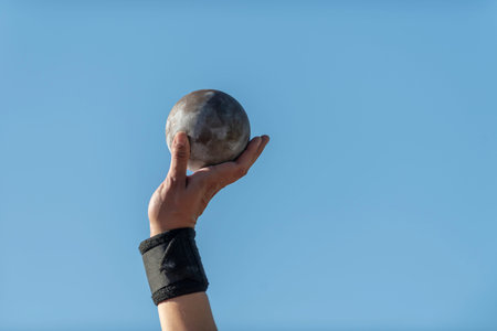 iiMan lifting shot put. Professional sport concept. Horizontal sport poster, greeting cards, headers, websiteの写真素材