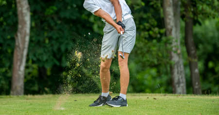 Professional golf player in action. Horizontal sport and golf club, course theme poster, greeting cards, headers, website and appの写真素材