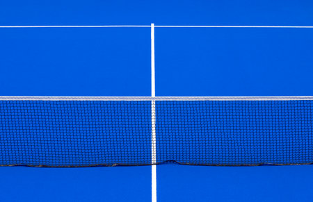 Blue padel and tennis net and hard court. Tennis competition concept. Horizontal sport theme poster, greeting cards, headers, website and appの写真素材