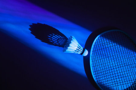 Badminton racket and shuttlecock on blue background. Horizontal sport theme poster, greeting cards,...