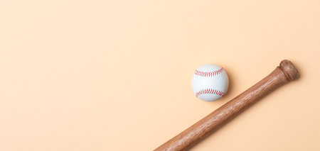 Baseball bat and ball on beige background. Horizontal sport theme poster, greeting cards, headers, website and appの写真素材