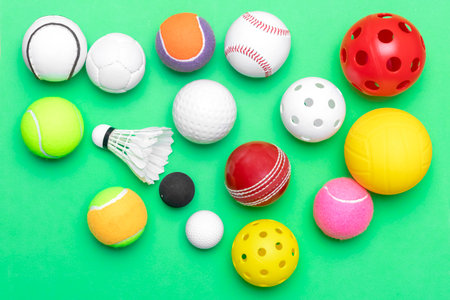 Sports equipment, balls on green background. Horizontal education and  ball sport poster, greeting cards, headers, websiteの写真素材