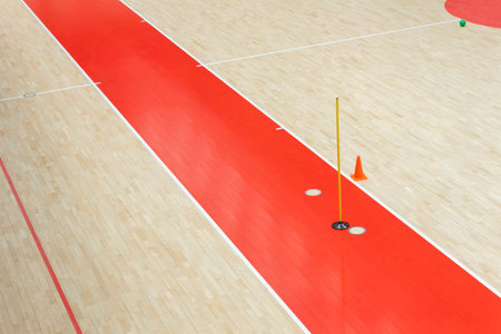 Training cones and ball on hardwood court floor. Basketball, futsal, handball and volleyball practice. Game equipment Horizontal sport theme poster, greeting cards, headers, website and appの写真素材