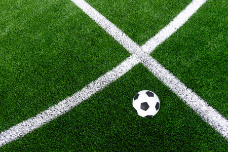 Black and white soccer and football ball in the field. Horizontal sport theme poster, greeting...