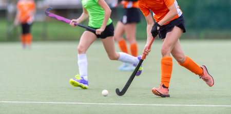 Field Hockey player, ready to pass the ball to a team mate. Horizontal sport theme poster, greeting...
