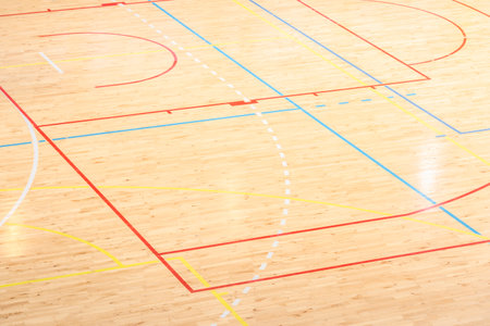 Wooden floor basketball, badminton, futsal, handball, volleyball, football, soccer court. Wooden floor of sports hall with marking lines on wooden floor indoor, gym courtの写真素材