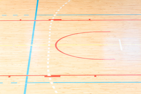 Wooden floor basketball, badminton, futsal, handball, volleyball, football, soccer court. Wooden floor of sports hall with marking lines on wooden floor indoor, gym courtの写真素材