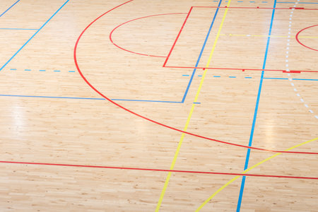 Wooden floor basketball, badminton, futsal, handball, volleyball, football, soccer court. Wooden floor of sports hall with marking lines on wooden floor indoor, gym courtの写真素材