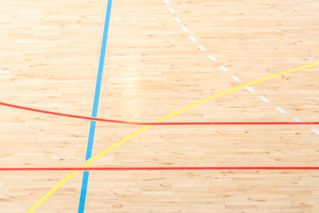 Wooden floor basketball, badminton, futsal, handball, volleyball, football, soccer court. Wooden floor of sports hall with marking lines on wooden floor indoor, gym courtの写真素材