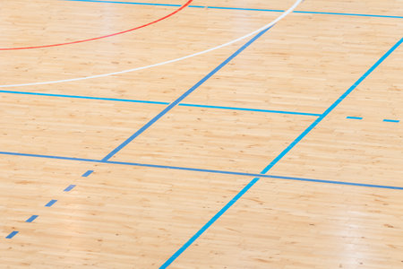 Wooden floor basketball, badminton, futsal, handball, volleyball, football, soccer court. Wooden floor of sports hall with marking lines on wooden floor indoor, gym courtの写真素材