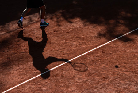 Tennis player shadow on a clay tennis court. Horizontal sport theme poster, greeting cards, headers, website and appの写真素材
