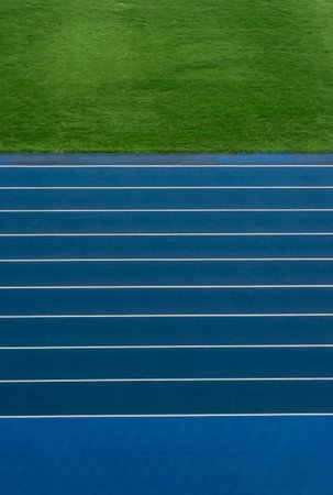 Blue track and field lanes. Running lanes at a track and field athletic stadium. Verticall sport theme poster, greeting cards, headers, website and appの写真素材