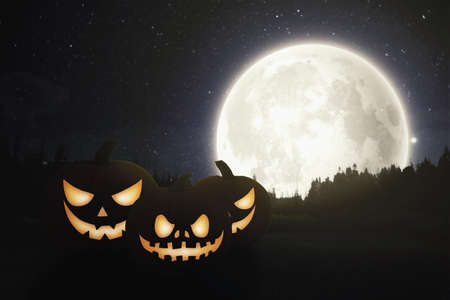 helloween pumpkins with the nightmoon backgroundの写真素材