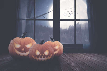 pumpkin's on the wood with window night backgroundの写真素材