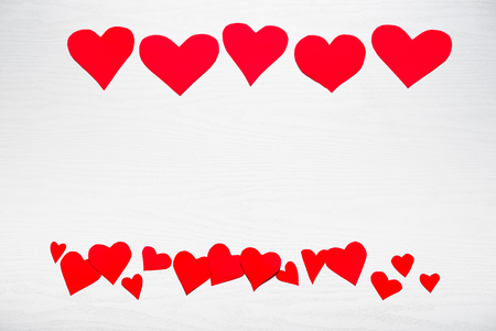 Wooden white background with red hearts. The concept of Valentine Day.の写真素材