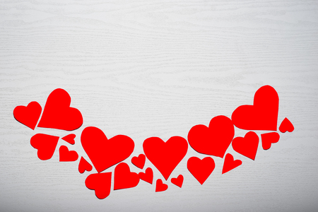 Wooden white background with red hearts. The concept of Valentine Day.の写真素材